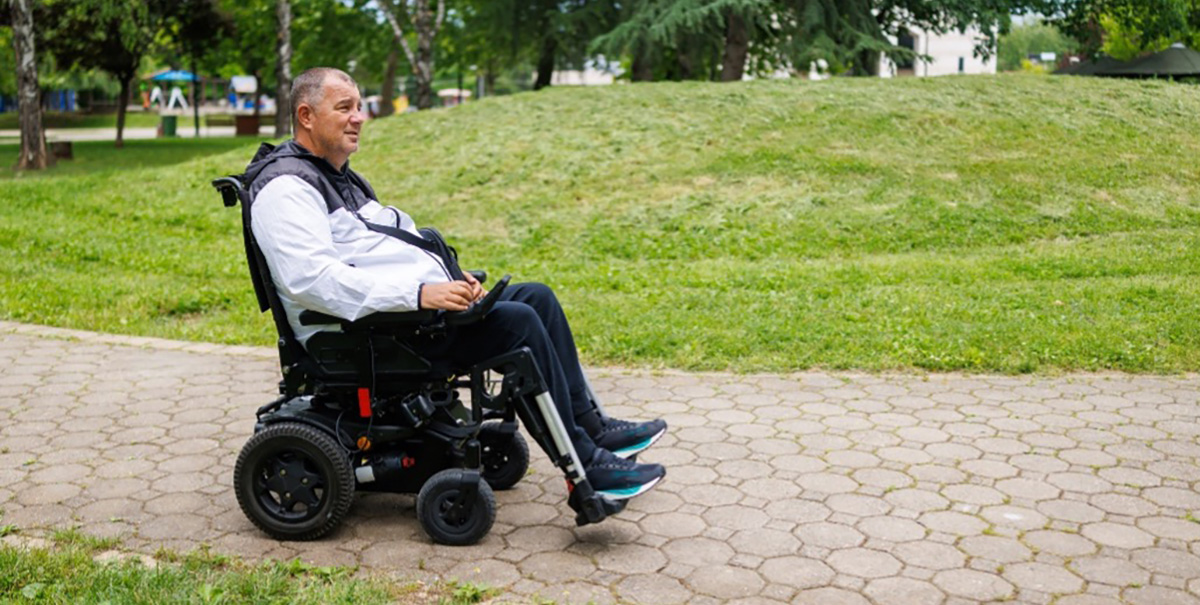 A man on a wheelchair.