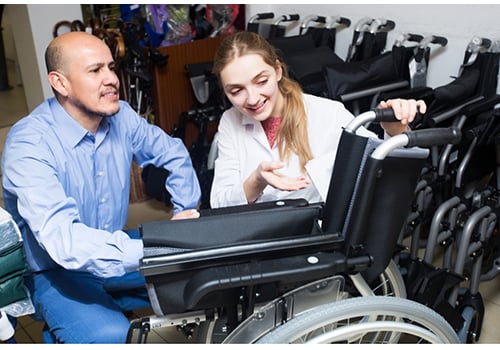 Two people shopping for wheelchairs | Mobility Blog